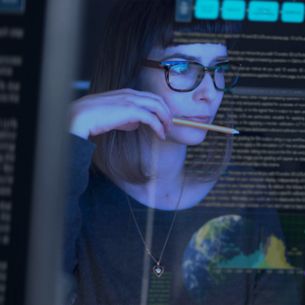 Woman looking at a computer screen with text