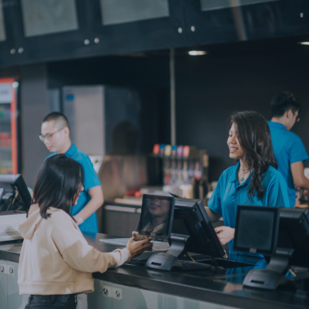 Woman ordering fast food from a cashier